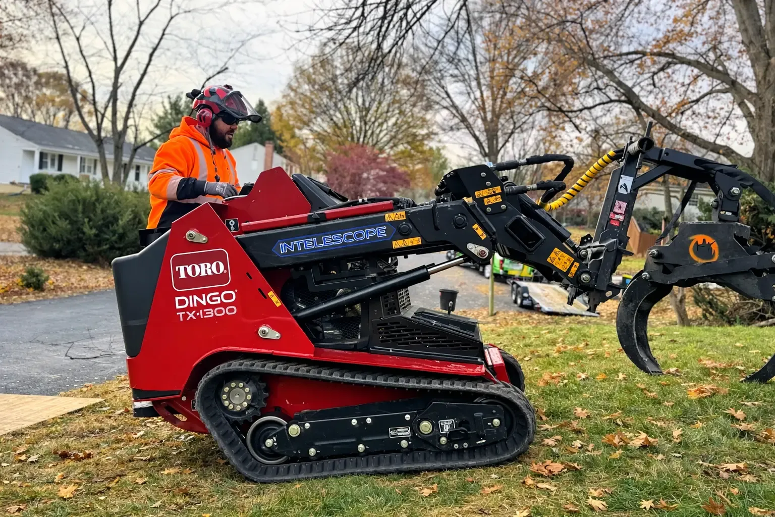 Green Tree Services operator on a compact tracked loader